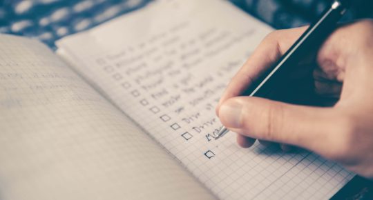 Person marking a checklist